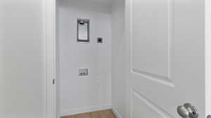 Washroom featuring light wood-type flooring and washer hookup