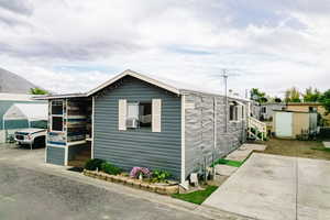 View of front of house featuring a storage shed
