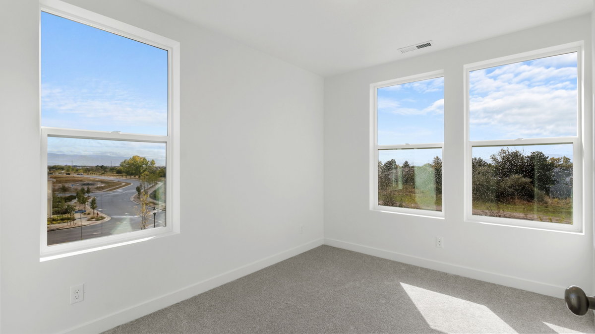 Spare room with carpet flooring and healthy amount of natural light