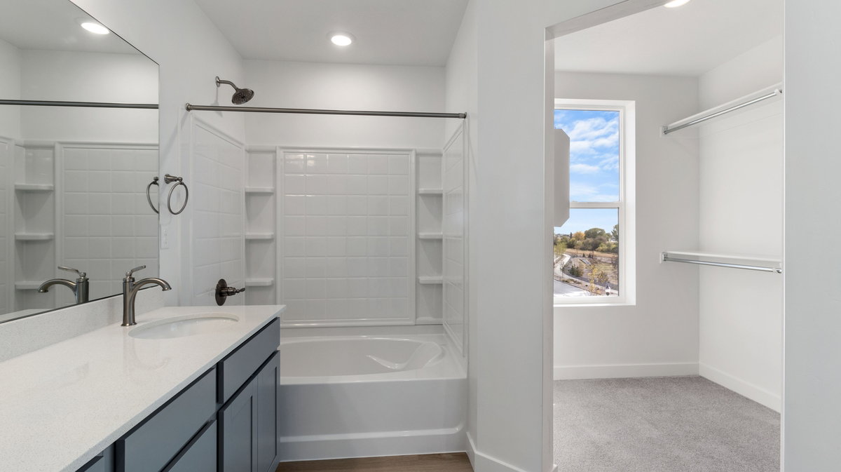 Bathroom featuring shower / bathtub combination, vanity, recessed lighting, and light colored carpet