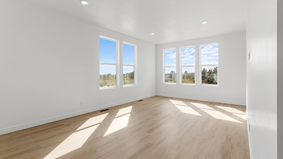 Spare room featuring light wood-type flooring and recessed lighting