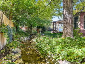 Fenced backyard featuring a wooden deck