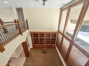 Wine area with recessed lighting and carpet flooring