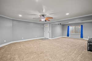 Unfurnished room with ornamental molding, light colored carpet, a ceiling fan, recessed lighting, and baseboard heating