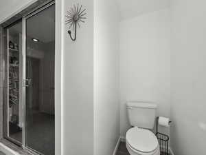 Bathroom with tile patterned floors and a shower stall