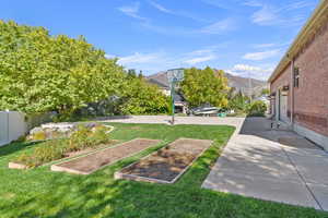 View of yard featuring a garden and a mountain view