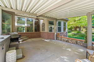 View of patio featuring grilling area and ceiling fan