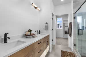 PRIMARY SUITE BATHROOM W/ WARM STAINED CABINETS, QUARTZ COUNTERTOPS & DOUBLE SINKS!    (PICTURE OF PREVIOUS BUILT HOME-OPTIONS, COLORS AND MATERIALS MAY VARY)