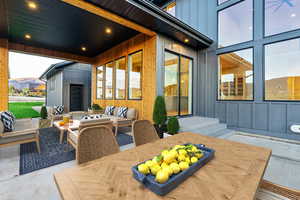 View of patio / terrace with an outdoor living space, outdoor dining area, and a mountain view