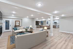 Living room featuring light wood-style floors and recessed lighting