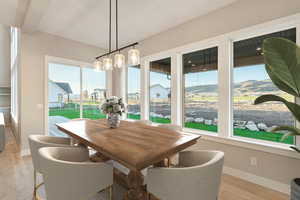 Dining area featuring baseboards and light wood-style flooring