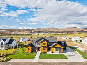 Aerial perspective of suburban area with a mountainous background