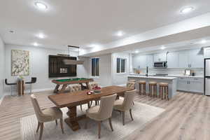 Dining area featuring light wood-type flooring, billiards, and recessed lighting