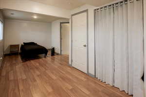 Bedroom featuring light wood finished floors and recessed lighting