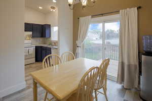 Dining area featuring a chandelier and light wood finished floors