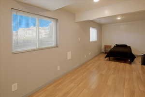 Bedroom with light wood-type flooring and recessed lighting
