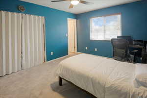Bedroom with carpet and ceiling fan