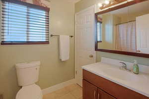 Bathroom with vanity and light tile patterned floors