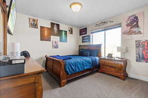 Carpeted bedroom with baseboards