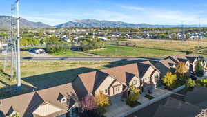 Aerial perspective of suburban area featuring a mountainous background