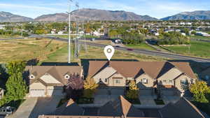 Aerial perspective of suburban area featuring a mountain backdrop