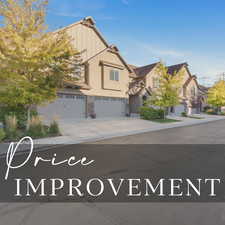 View of front of house featuring an attached garage and driveway