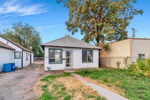View of front of home with a shingled roof