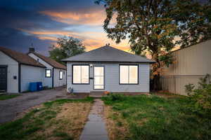 View of front of house featuring a shingled roof and entry steps