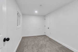 Unfurnished room with carpet floors and recessed lighting
