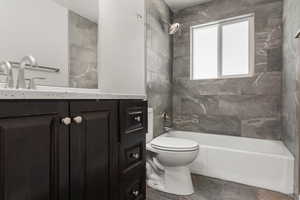 Bathroom with bathing tub / shower combination and vanity