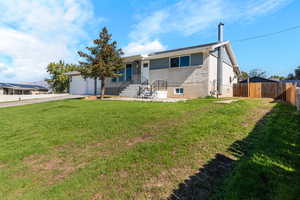 Rambler home with driveway and an attached garage