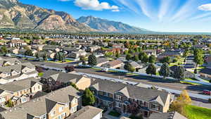 Aerial perspective of suburban area featuring a mountainous background