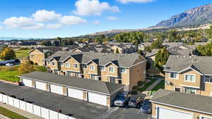 Aerial view of residential area featuring a mountain backdrop