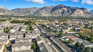 Aerial view of property's location with a mountainous background and nearby suburban area