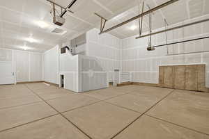 Garage featuring a garage door opener