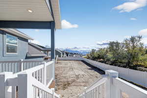 Fenced backyard with a mountain view and stairs