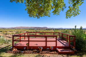Wooden terrace featuring a mountain view