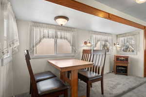 Dining space featuring carpet flooring