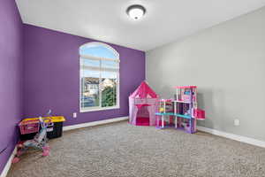 Playroom with carpet and baseboards
