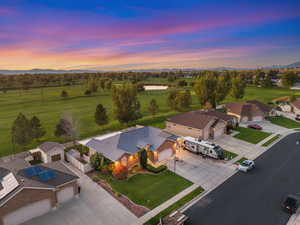 Bird's eye view of a golf course and a water and mountain view