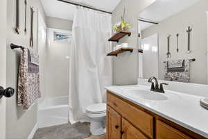 Bathroom featuring vanity and shower / bath combo