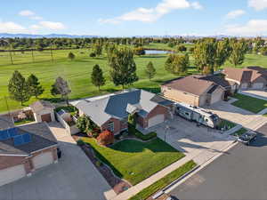 Aerial view of a golf club and a water and mountain view