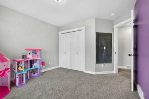 Rec room with carpet floors and baseboards