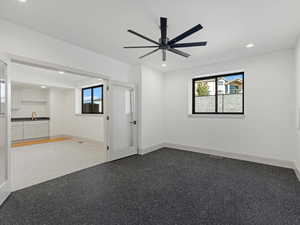 Spare room featuring recessed lighting and a ceiling fan