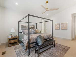 Bedroom with light carpet, ceiling fan, and recessed lighting