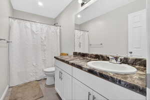 Full bathroom with vanity and a shower with curtain