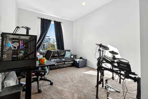 Carpeted home office with recessed lighting and baseboards