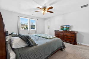 Bedroom with carpet and a ceiling fan