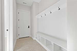 Mudroom featuring baseboards