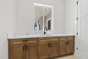 Bathroom featuring vanity and light tile patterned floors